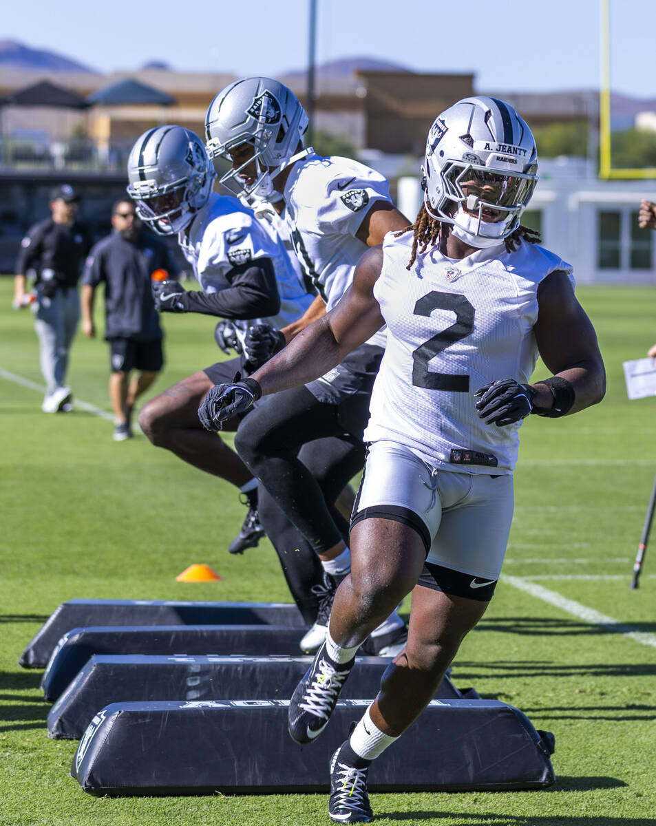 Raiders running back Ashton Jeanty (2) runs a drill with teammates on the second day of trainin ...