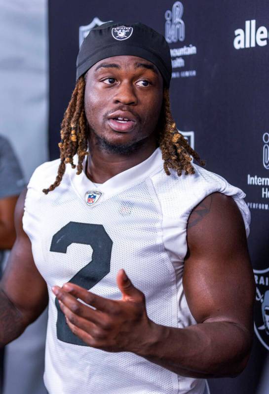 Raiders running back Ashton Jeanty (2) answers a question during an interview on the second day ...