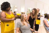 Madi Krause gets her hair done by stylist Jasmine Fletcher during the grand opening of a since- ...