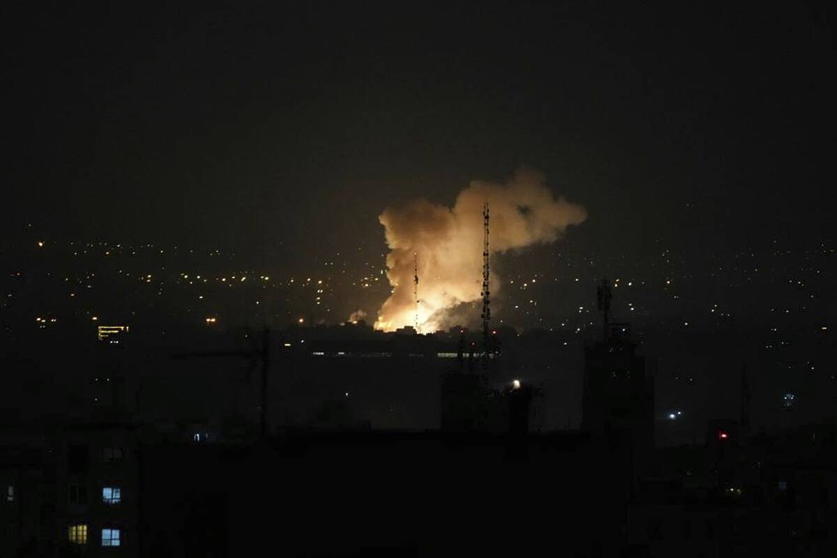 Smoke rises after an explosion in Tehran, Iran, Friday, June 13, 2025. Israel attacked Iran's c ...
