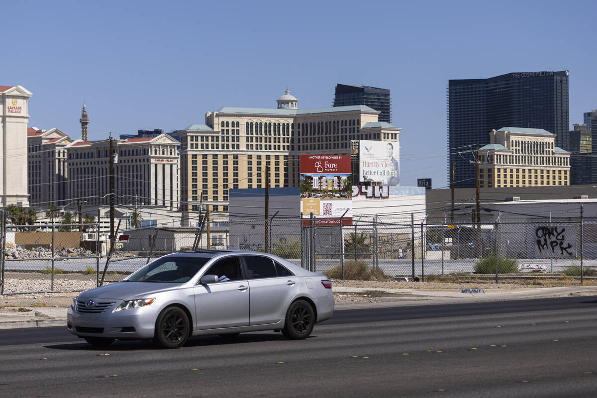 A car passes by an empty lot at 3640 S. Valley View Blvd., which is slated for future apartment ...