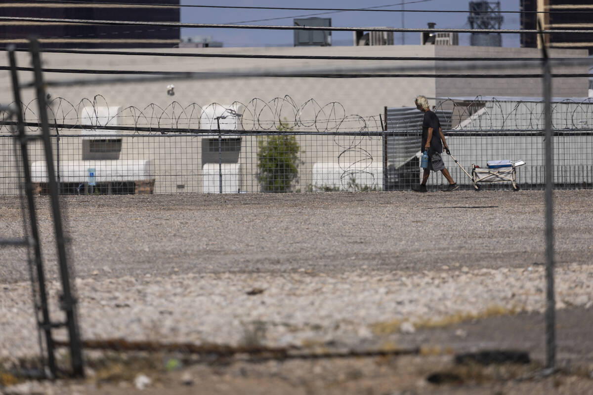 A man walks through an empty lot at 3640 S. Valley View Blvd., which is slated for future apart ...