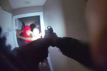 In a frame grab from a body camera video, an intruder identified as Alejandra Boudreaux left, a ...