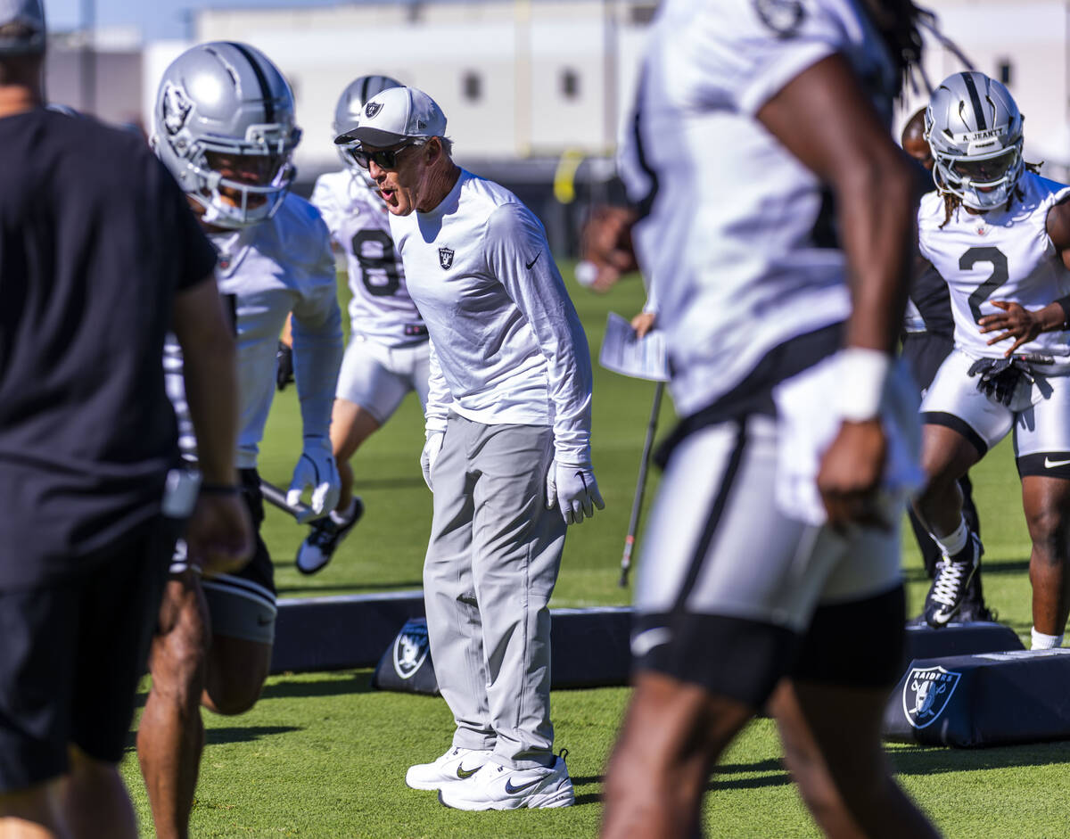 Raiders head coach Pete Carroll motivates his players on a drill during the third day of traini ...