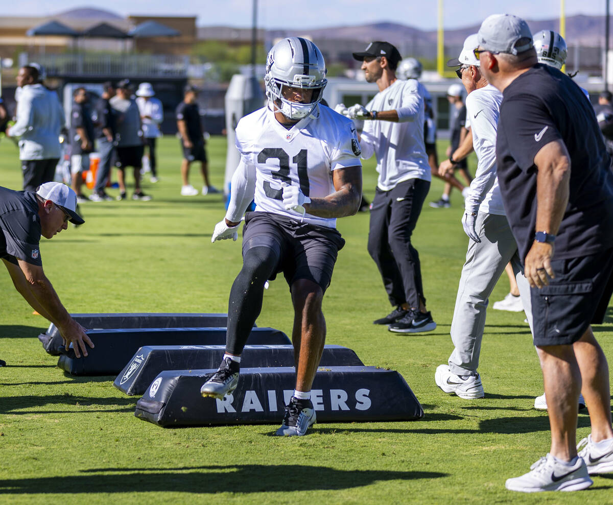 Raiders running back Raheem Mostert (31) runs a drill during the third day of training camp on ...