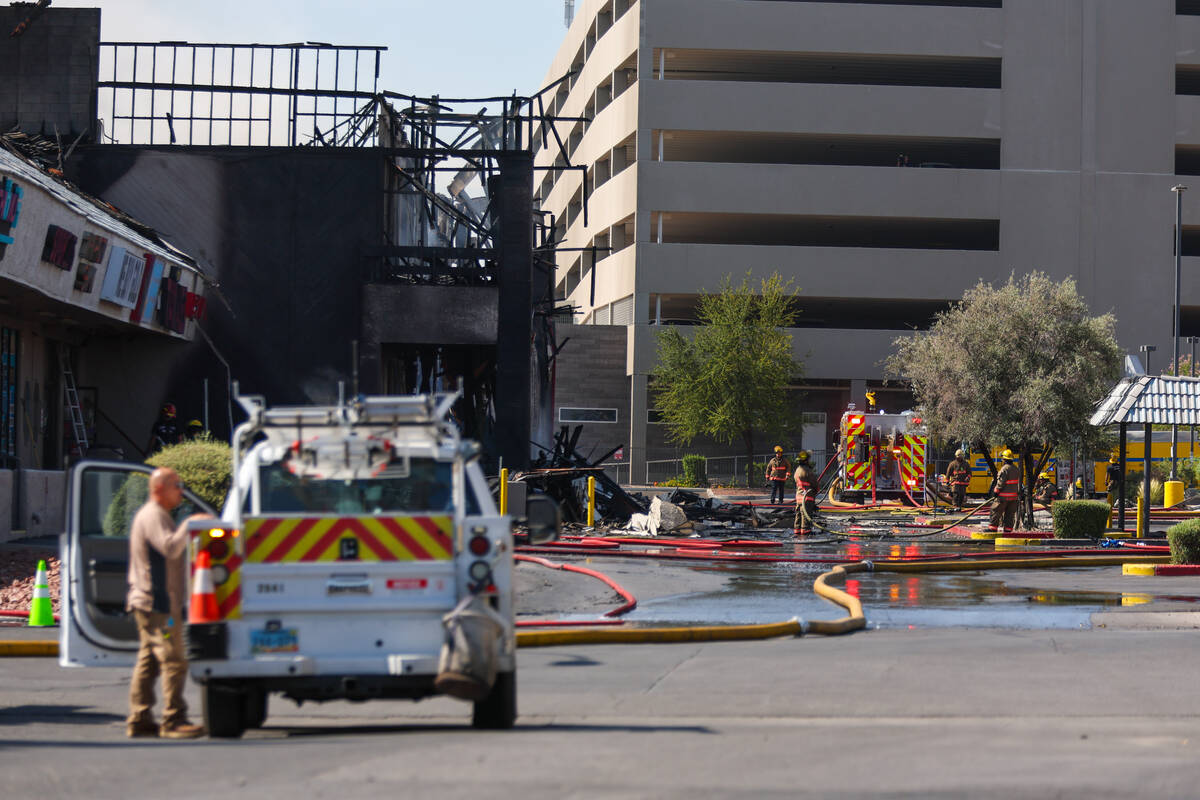 Firefighters battle a fire on Maryland Parkway near the UNLV campus on Friday, July 25, 2025 in ...