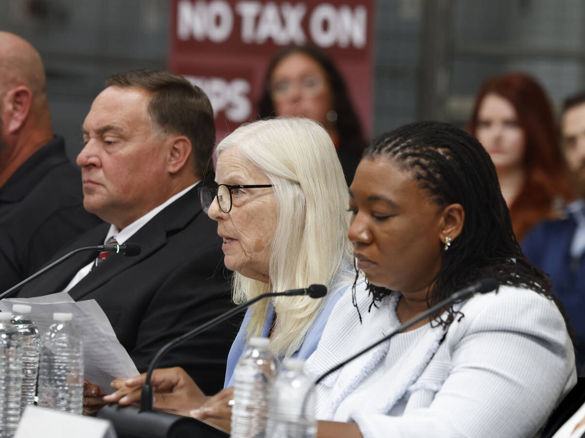 Nancy Overman, a retired hospital/hospice volunteer manager, center, testifies supporting Presi ...