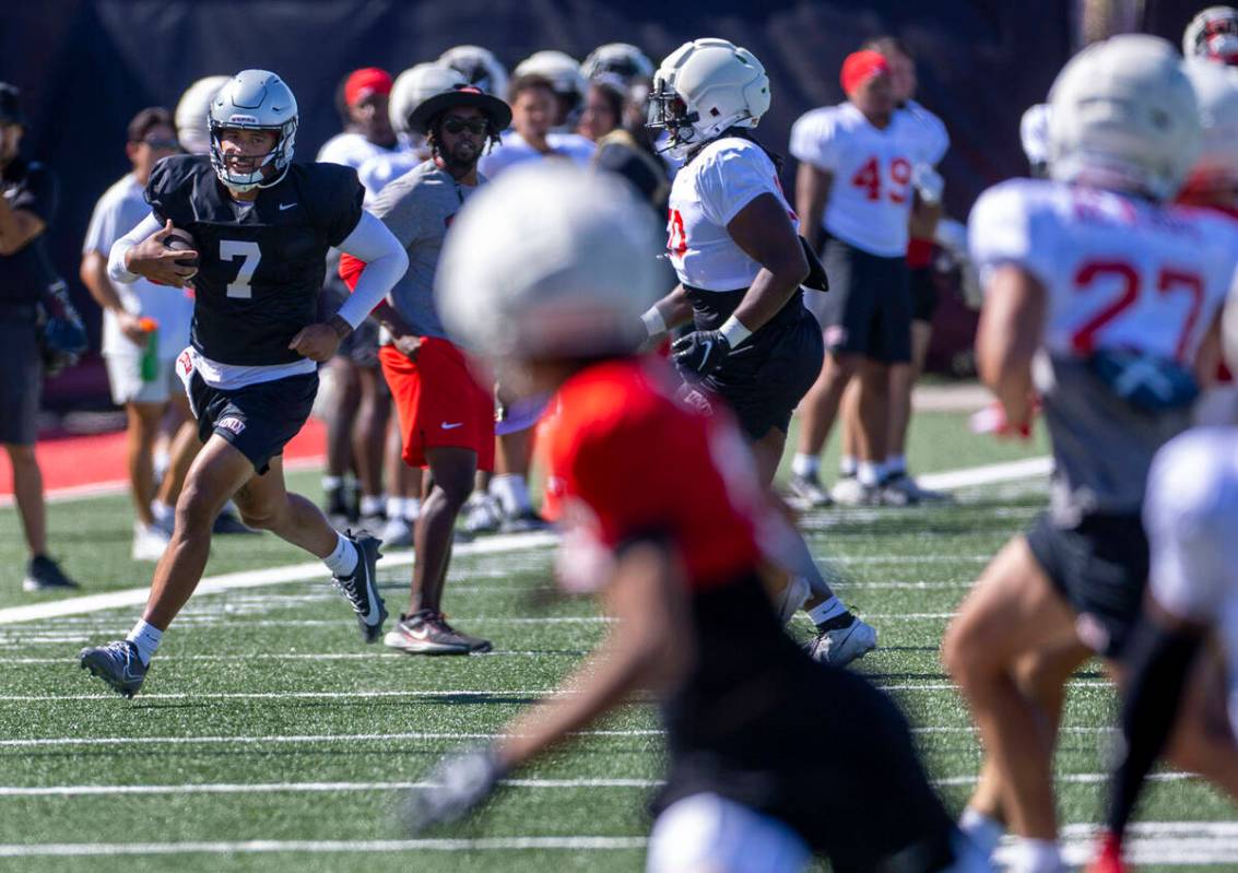 UNLV quarterback Cameron Friel (7) takes off on a run down the sideline during football practic ...