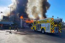 Clark County firefighters work to put out a three-alarm building fire on the 4600 block of Mary ...