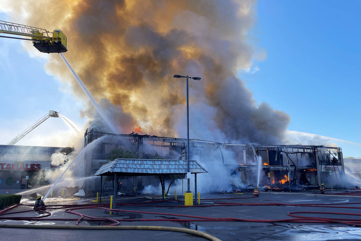 Clark County firefighters work to put out a three-alarm building fire on the 4600 block of Mary ...