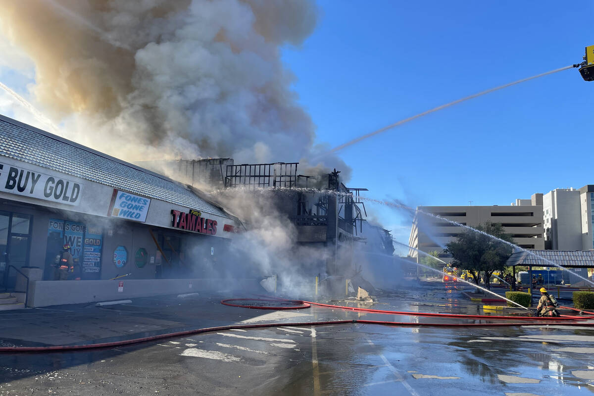 Clark County firefighters work to put out a three-alarm building fire on the 4600 block of Mary ...