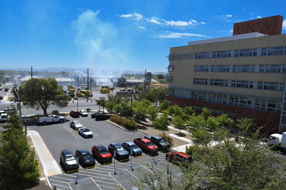 Firefighters finish putting out a three-alarm building fire on the 4600 block of Maryland Parkw ...