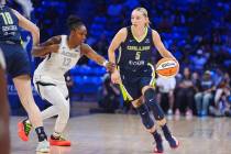 Dallas Wings guard Paige Bueckers (5) drives against Las Vegas Aces guard Chelsea Gray (12) dur ...