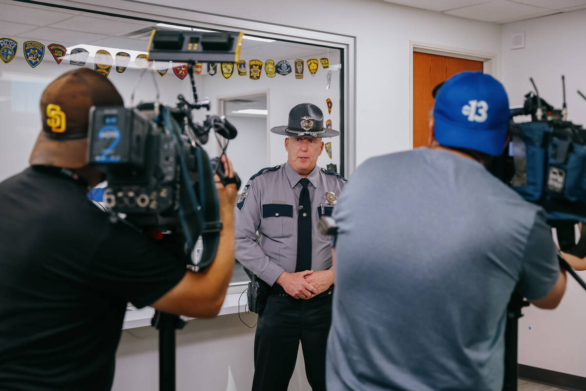 Nevada Highway Patrol Public Information Officer Shawn Haggstrom speaks with journalists about ...