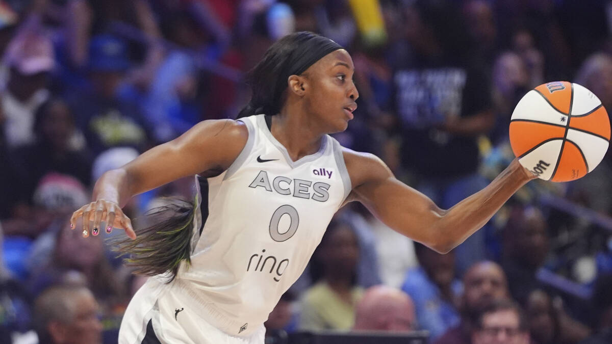 Las Vegas Aces guard Jackie Young takes control of the ball during the first half of a WNBA bas ...