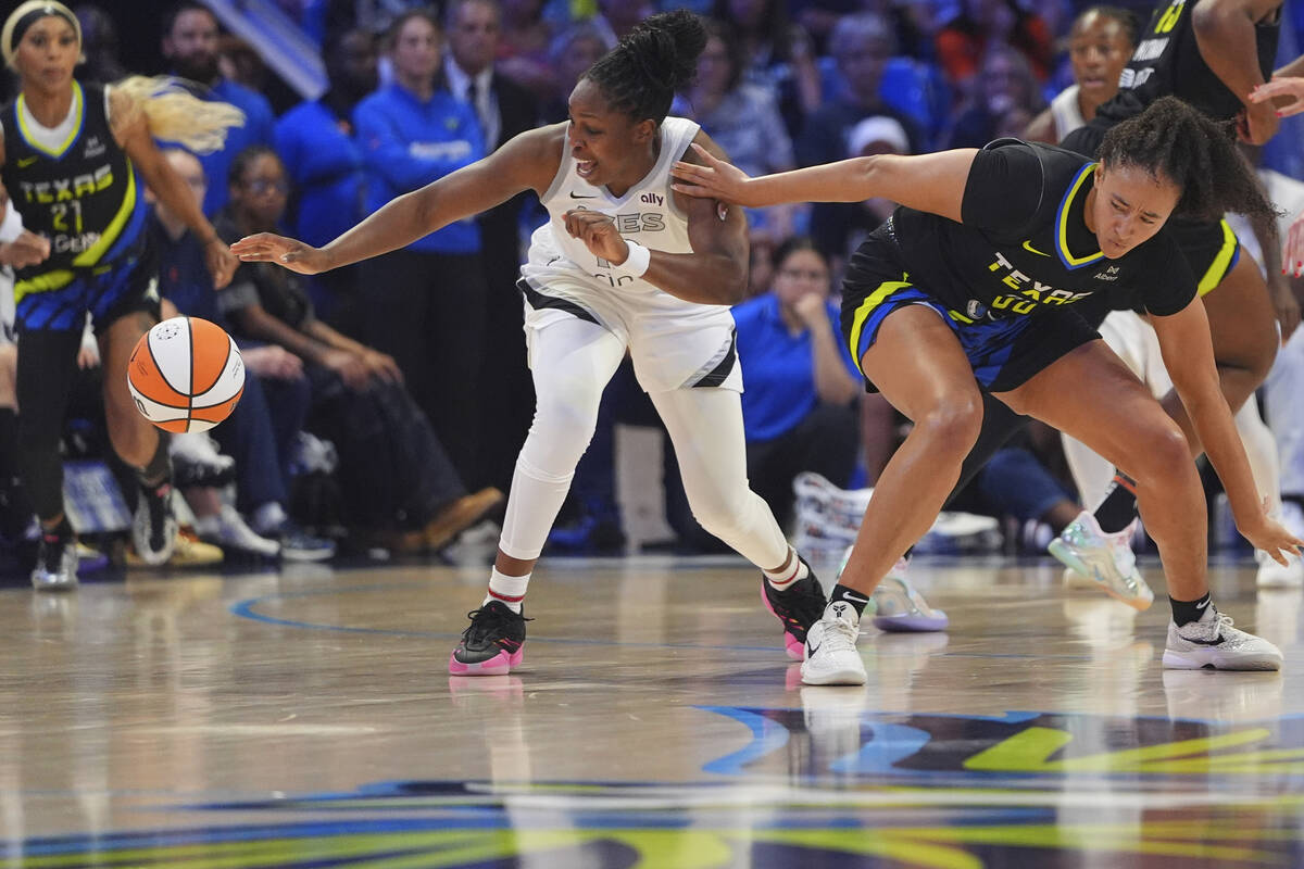 Las Vegas Aces guard Chelsea Gray, front left, steals the ball from Dallas Wings guard Haley Jo ...