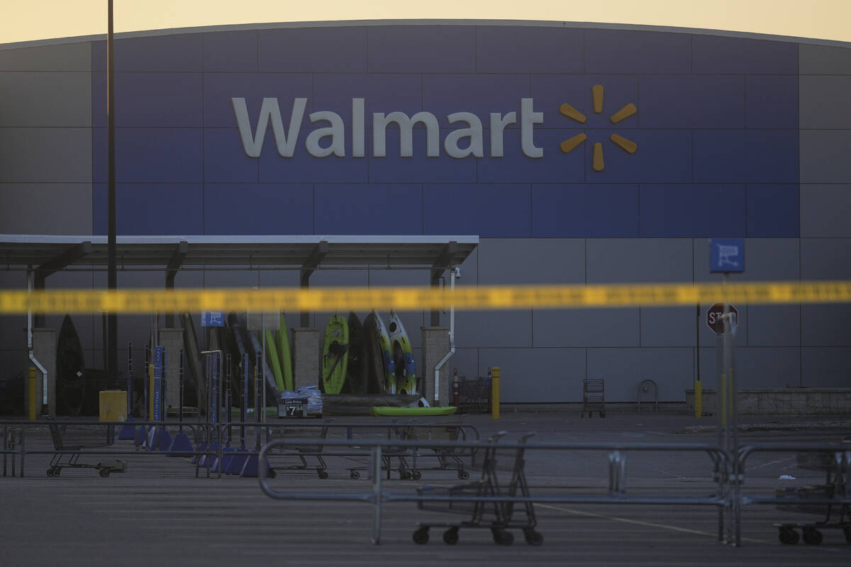 Police tape is seen outside a Walmart where multiple people were stabbed in a violent attack Sa ...