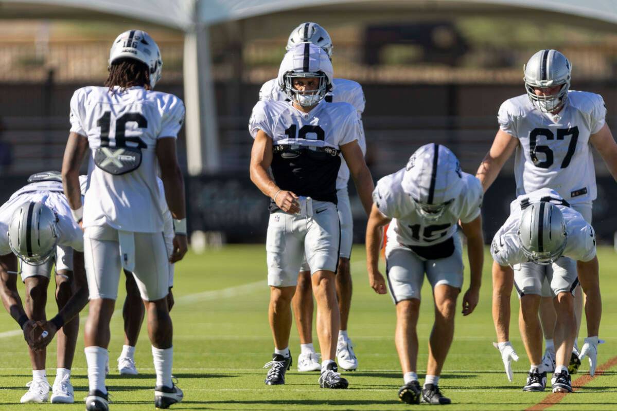 Raiders wide receiver Jack Bech (18) stretches with his teammates during the team’s trai ...