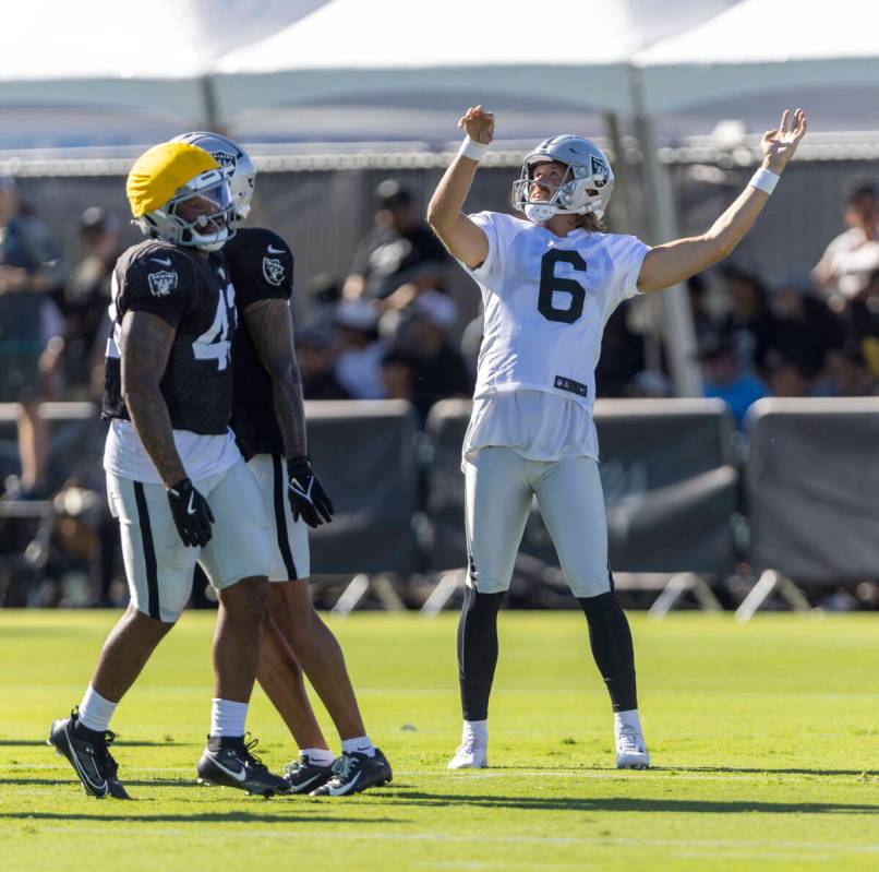 Raiders punter AJ Cole (6) watches his punt travel during the team’s training camp at th ...