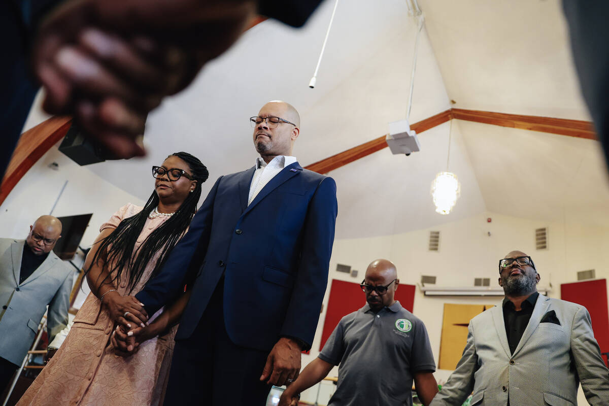 Nevada Attorney General Aaron Ford, right, and his wife, Berna Rhodes-Ford, are surrounded in a ...