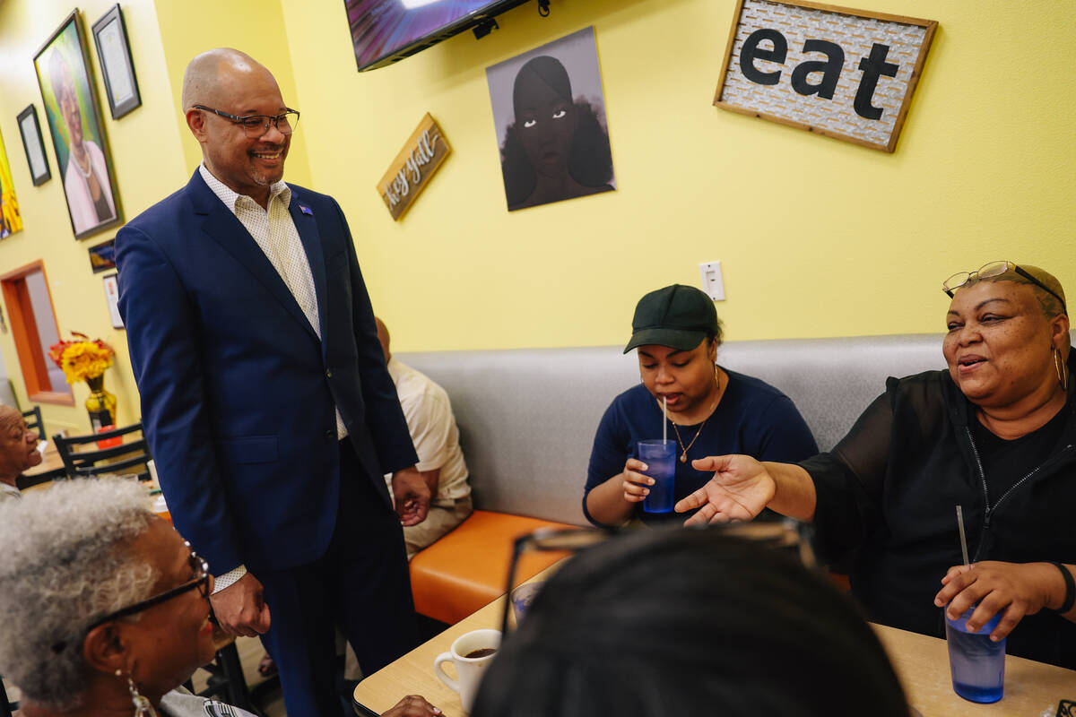 Nevada Attorney General Aaron Ford visits with customers at Gritz Cafe as his campaign for gove ...