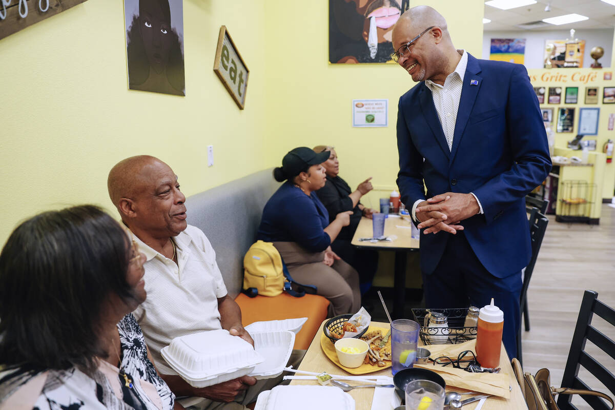 Nevada Attorney General Aaron Ford visits with customers at Gritz Cafe as his campaign for gove ...