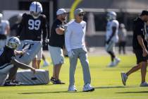 Raiders head coach Pete Carroll walks through practice during the team’s training camp a ...
