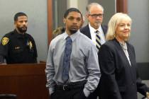 Isaac George is led into a courtroom with his attorneys Ozzie Fumo and Lisa Rasmussen during hi ...