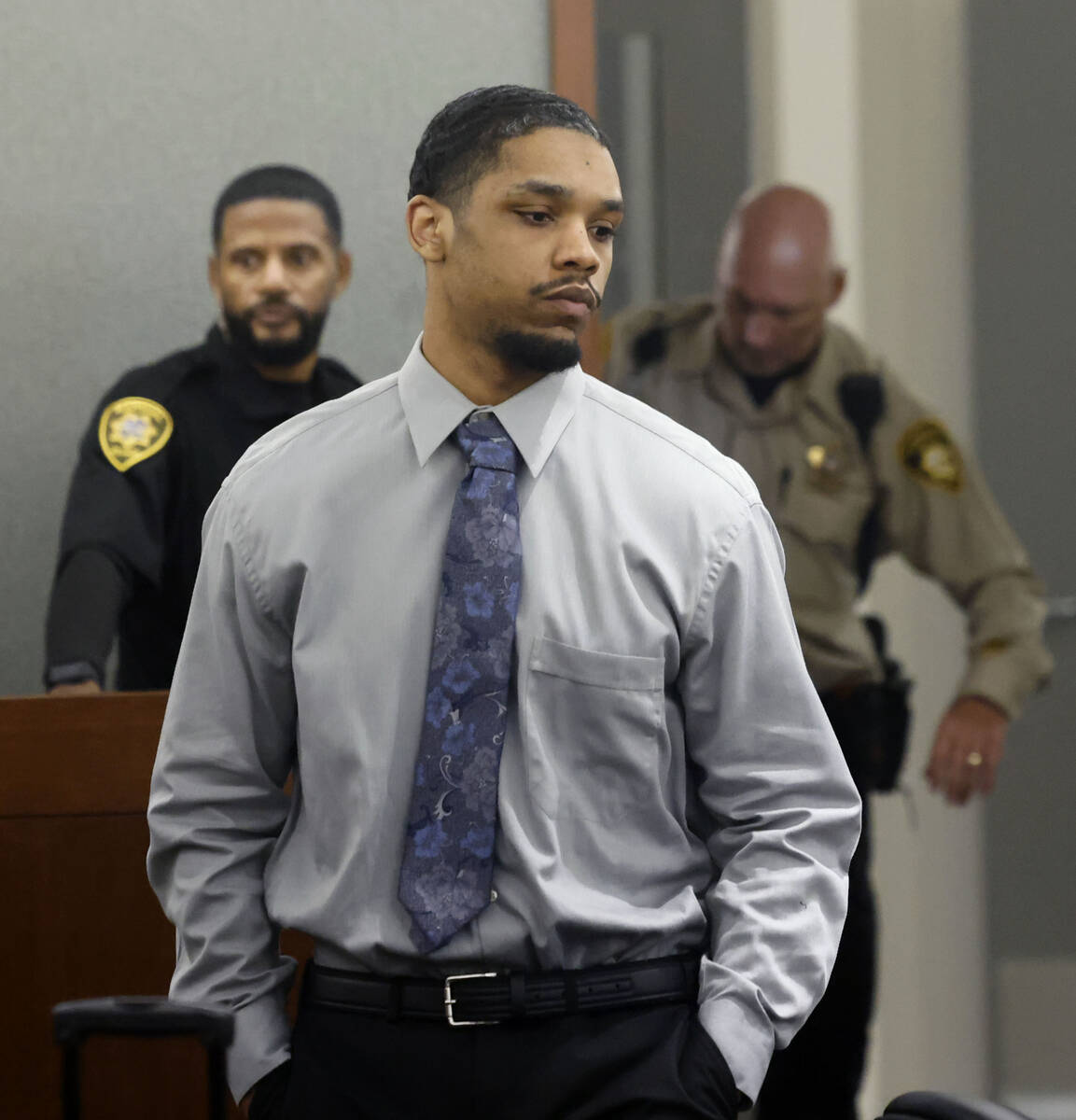 Isaac George, who is accused of killing Angelina Erivas, 11, in 2018, is led into a courtroom d ...