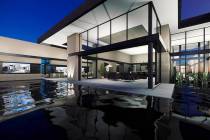 This artist's rendering shows a Blue Heron home under construction in MacDonald Highlands. Form ...