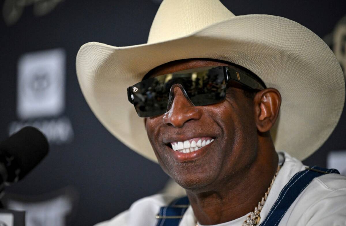 Colorado head coach Deion Sanders smiles before speaking about his journey in beating bladder c ...