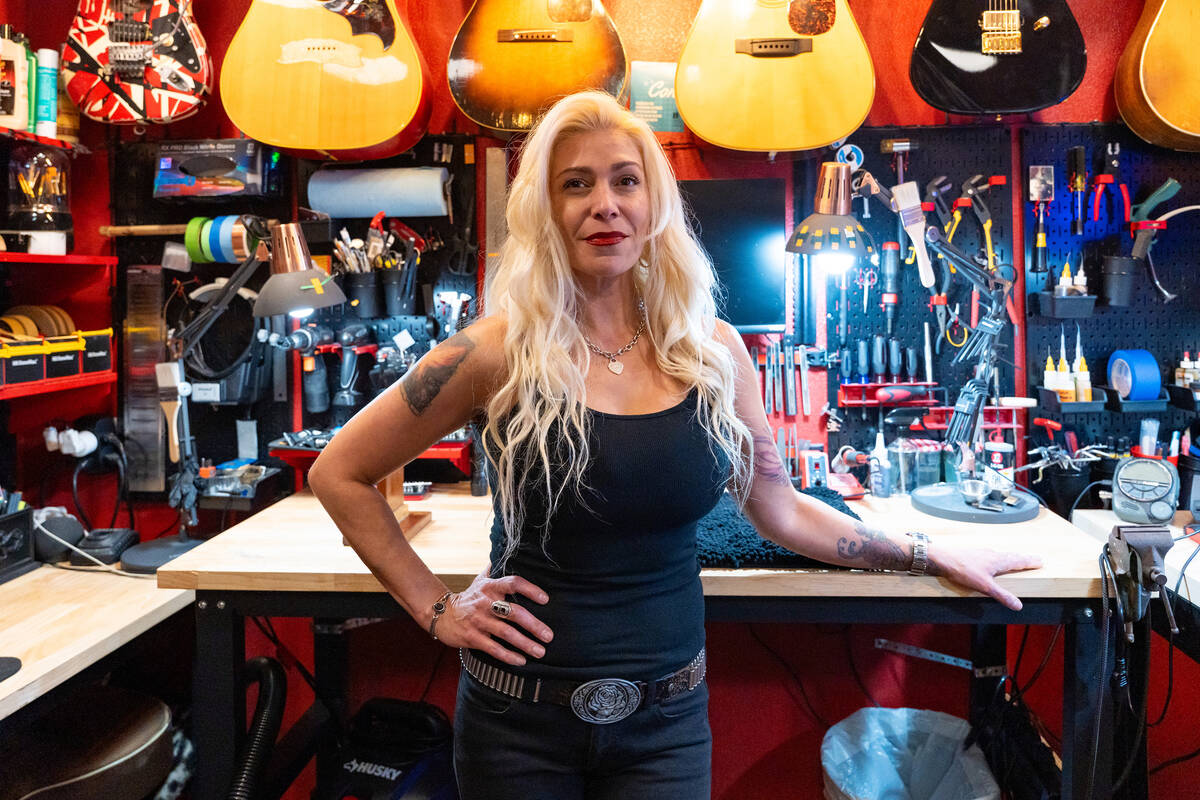 Teresa Topaz stands in her at-home guitar repair shop in Las Vegas July 28, 2025. She is the on ...