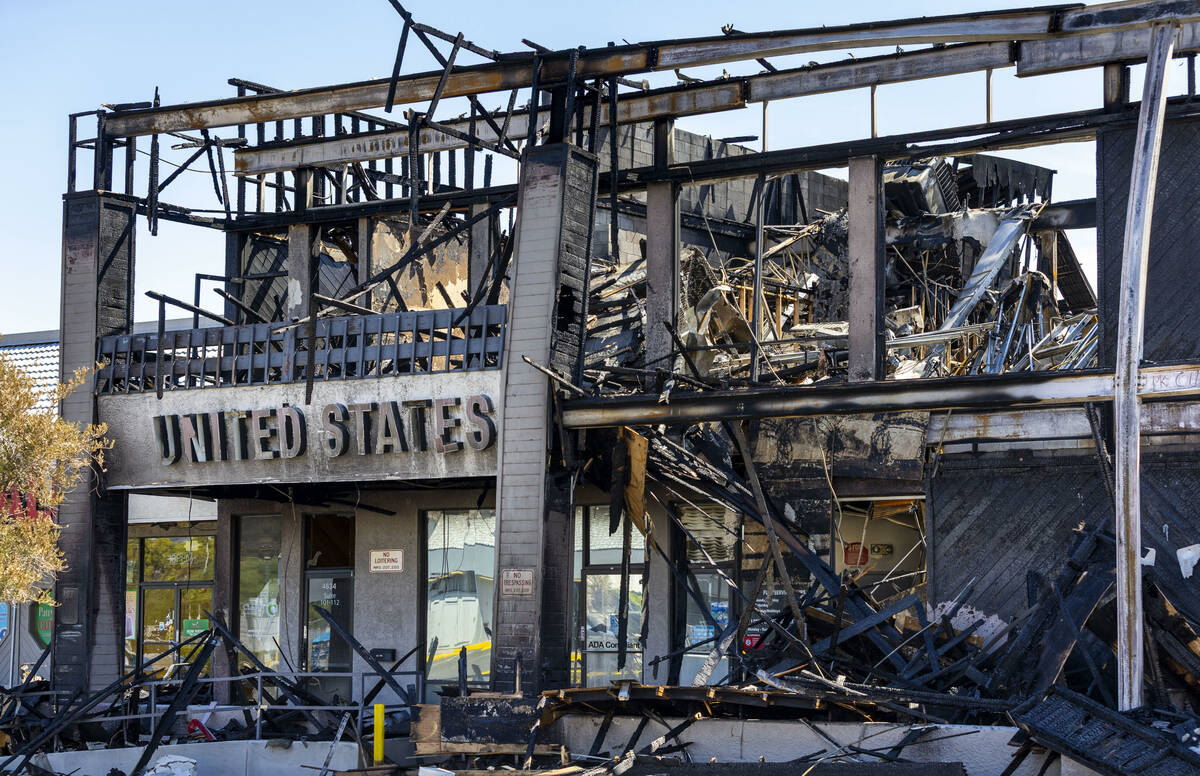 The burned exterior of the United States Post office at the University Gardens Shopping Center ...