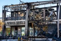 The burned exterior of the United States Post office at the University Gardens Shopping Center ...