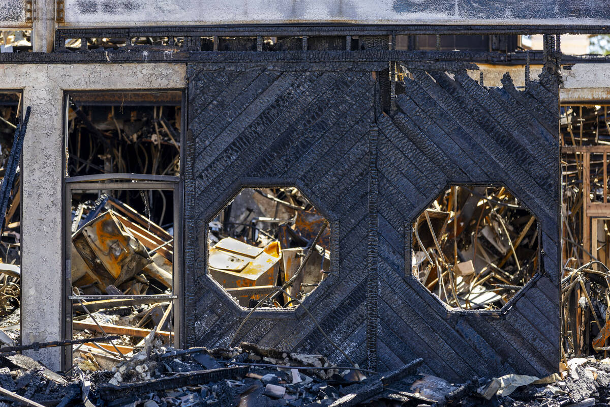 The fire damaged remains of the University Gardens Shopping Center on Saturday, July 26, 2025, ...