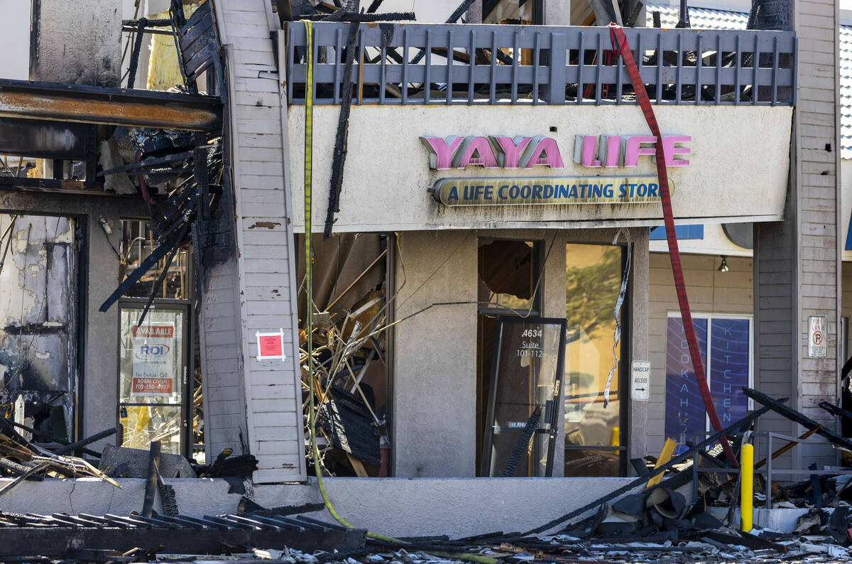 The fire and water damaged Yaya Life store within the University Gardens Shopping Center on Sat ...