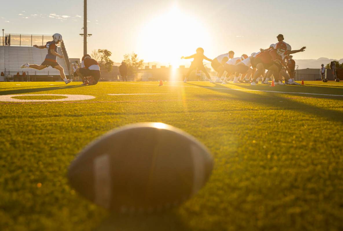 Liberty football players participate in the first day of football practice at Liberty High Scho ...