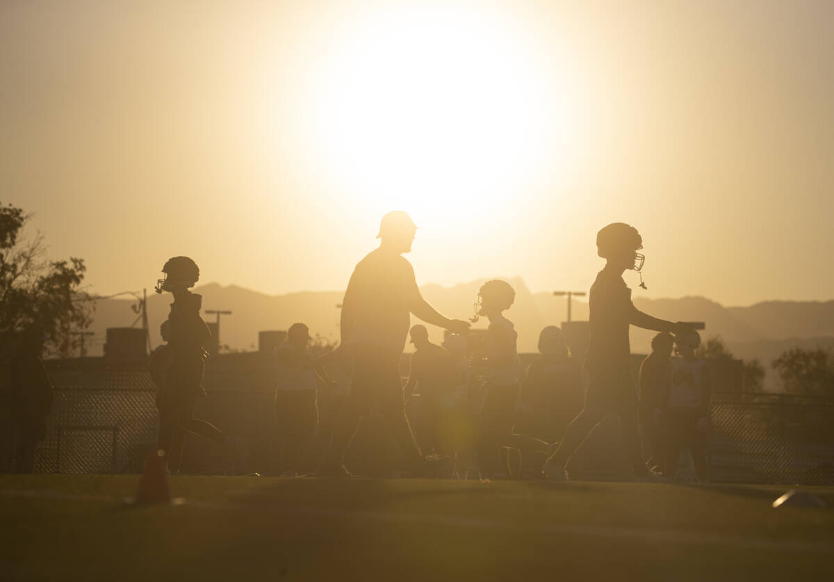 Liberty football players participate in the first day of football practice at Liberty High Scho ...