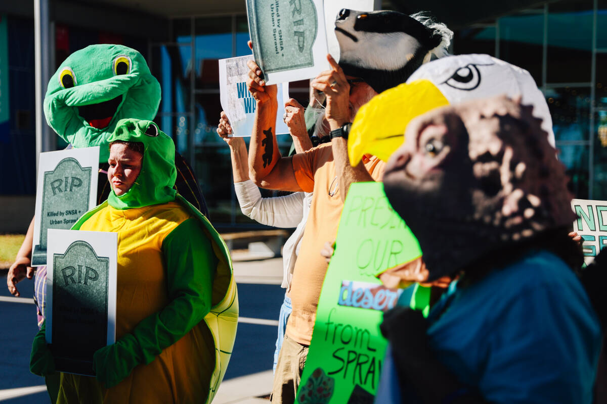 Environmental activists protest during a press conference about the Southern Nevada Supplementa ...