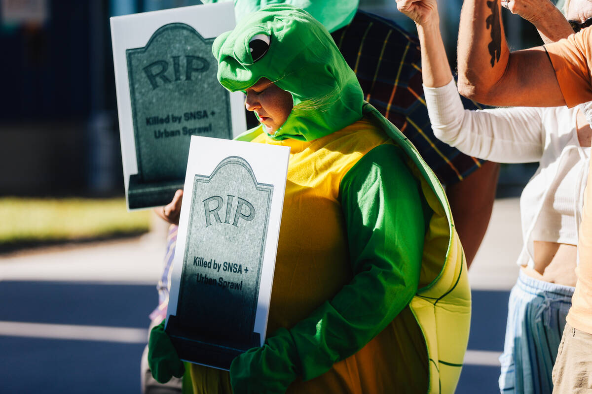 Environmental activists protest during a press conference about the Southern Nevada Supplementa ...