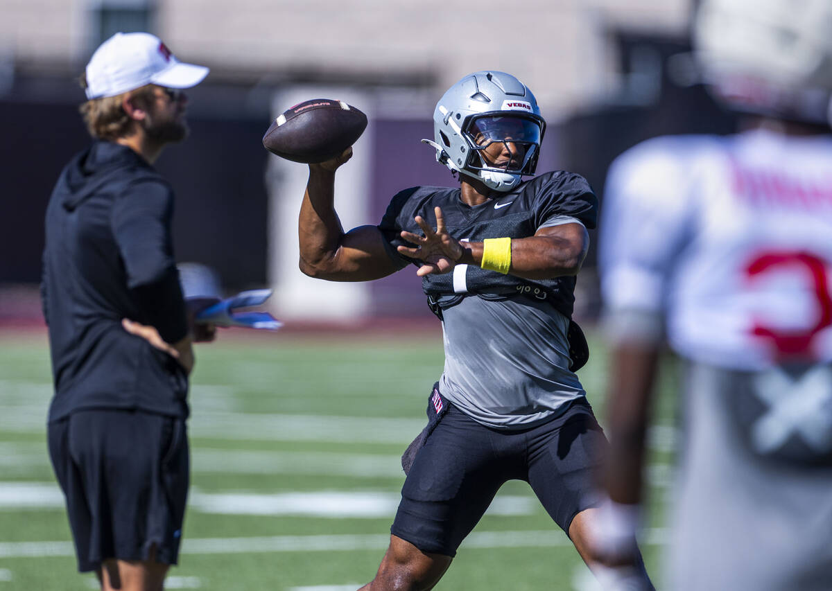 UNLV quarterback Alex Orji (1) sets up a pass during football practice at the Fertitta Football ...