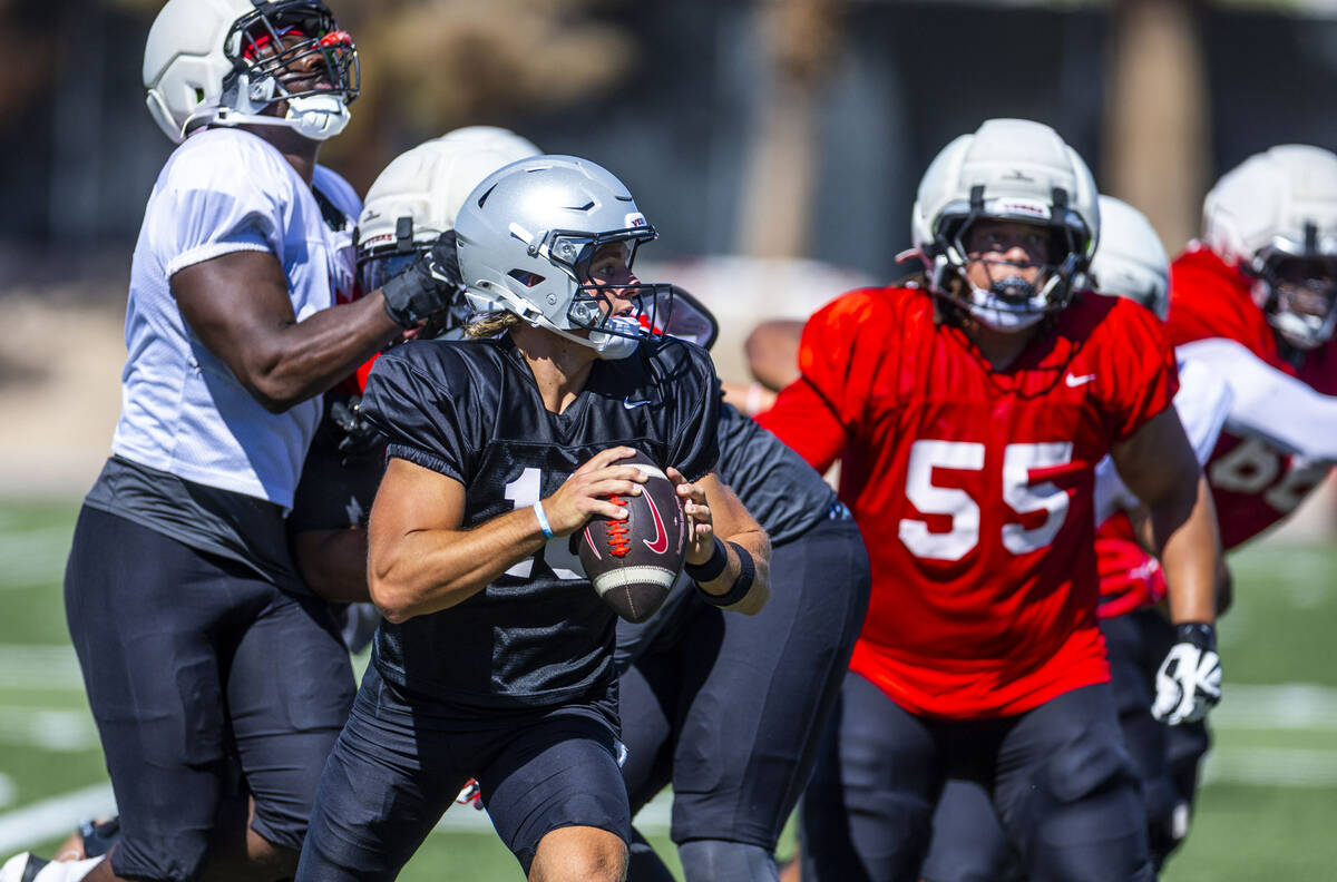 UNLV quarterback Anthony Colandrea (10) moves in the pocket eyeing a receiver during football p ...