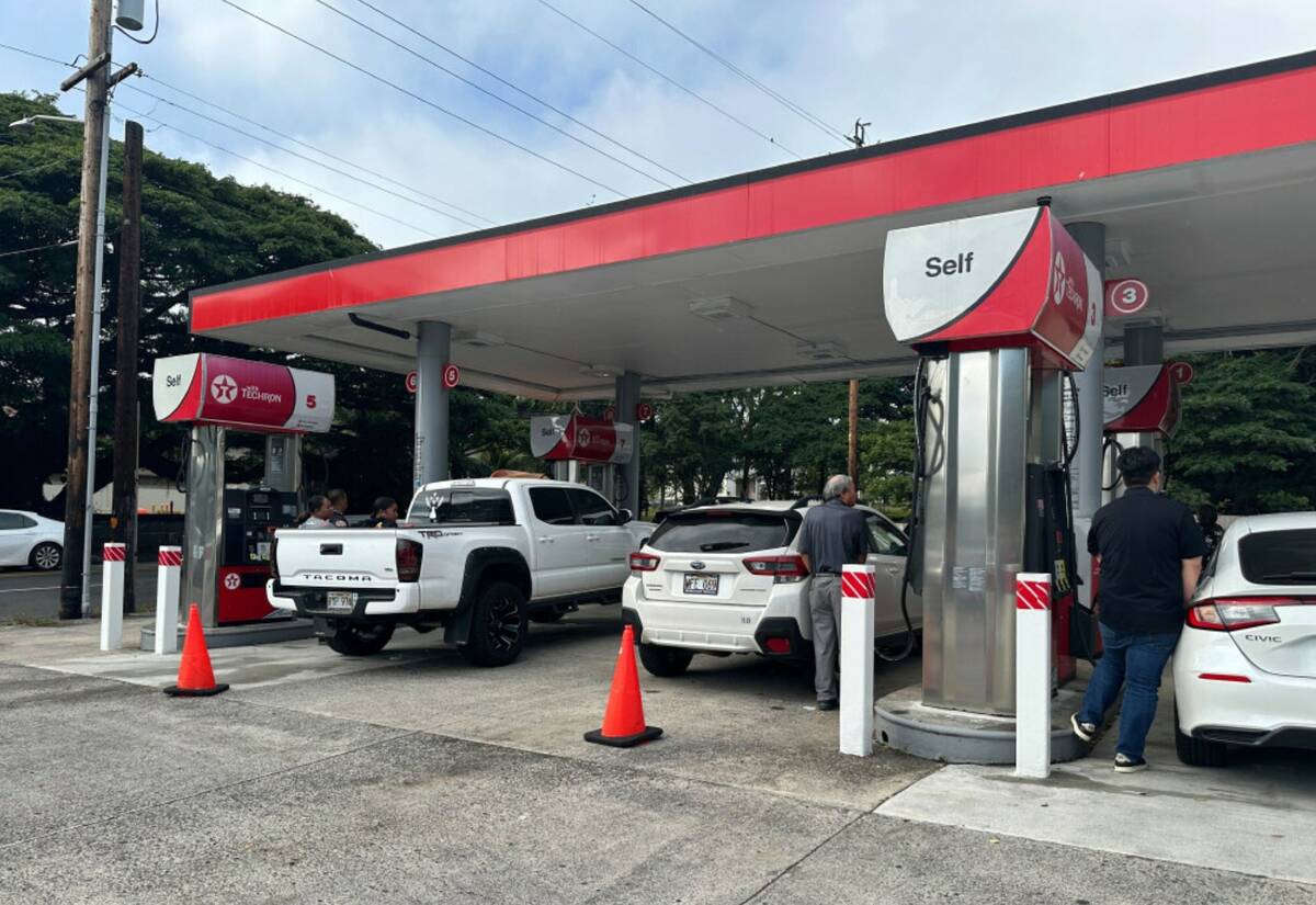 Motorists are turned away from a gas station that closed to allow employees to go home in Honol ...