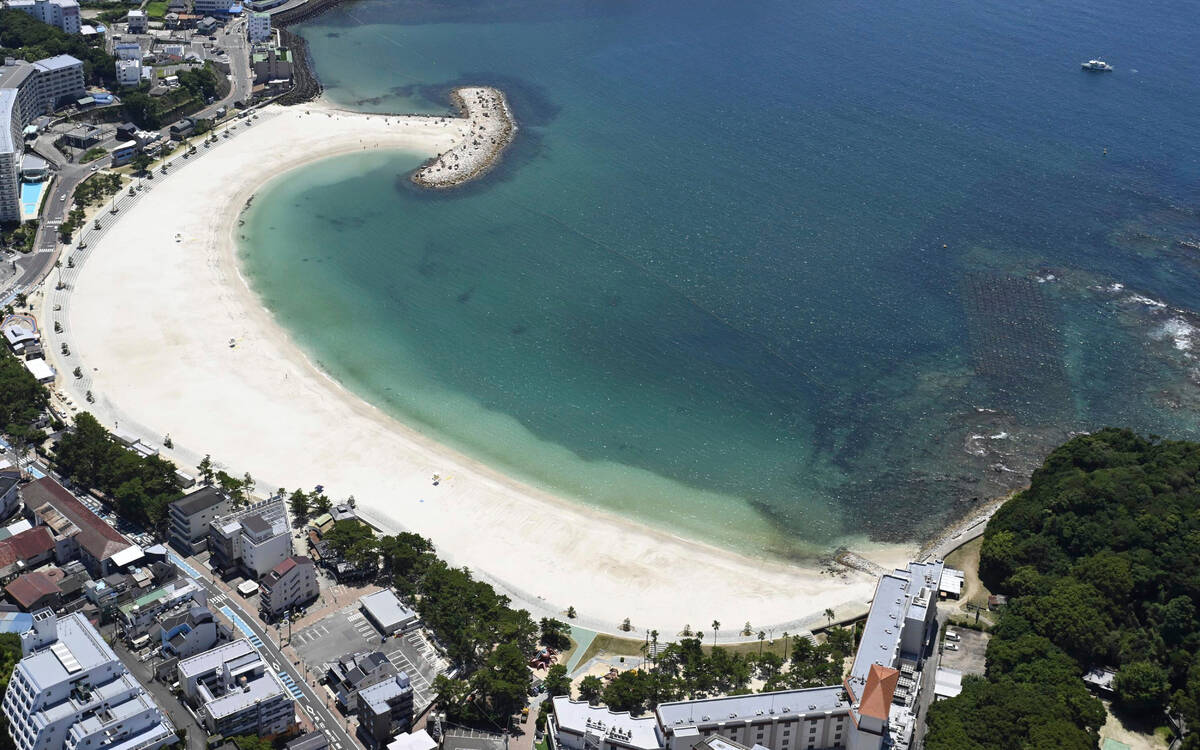 This shows an empty beach in Shirahama, Wakayama prefecture, western Japan Wednesday, July 30, ...
