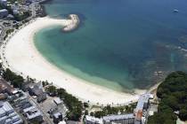This shows an empty beach in Shirahama, Wakayama prefecture, western Japan Wednesday, July 30, ...