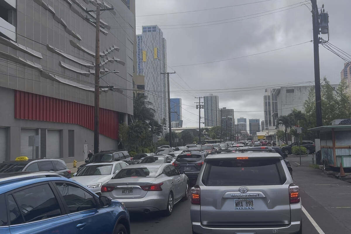 A traffic jam forms in Honolulu Tuesday, July 29, 2025 as people heed a tsunami evacuation warn ...