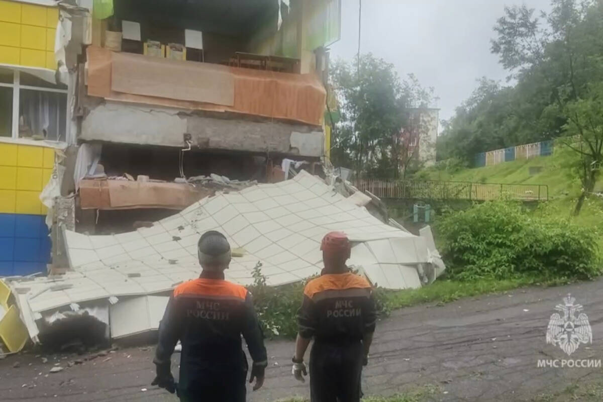 In this image taken from a video released by Russian Emergency Ministry Press Service, rescuers ...