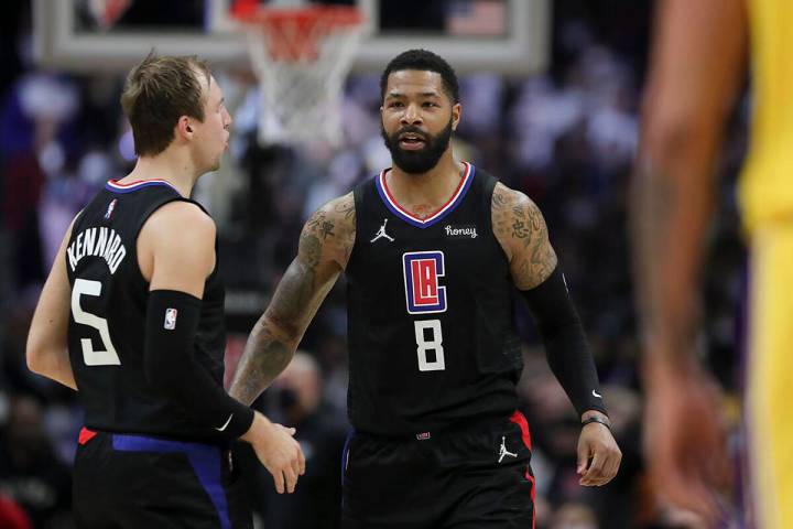 LA Clippers forward Marcus Morris Sr. (8) celebrates with guard Luke Kennard (5) after making t ...