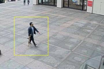 This image from surveillance video obtained by The Associated Press shows Shane Tamura outside ...