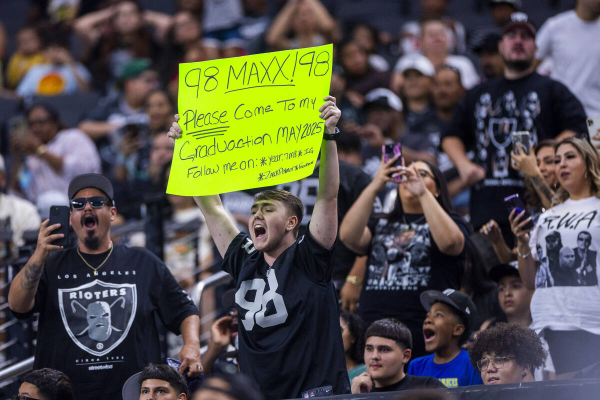 A Raiders fan wants to invite defensive end Maxx Crosby (98) to his graduation during an open p ...